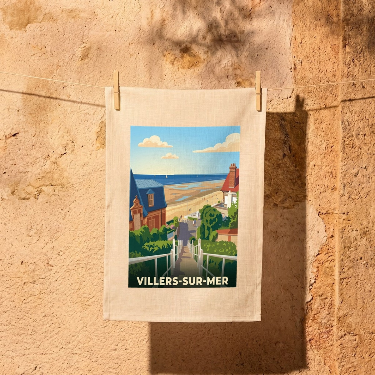 Torchon souvenir de la ville de Villers-sur-Mer avec une illustration stylisée.