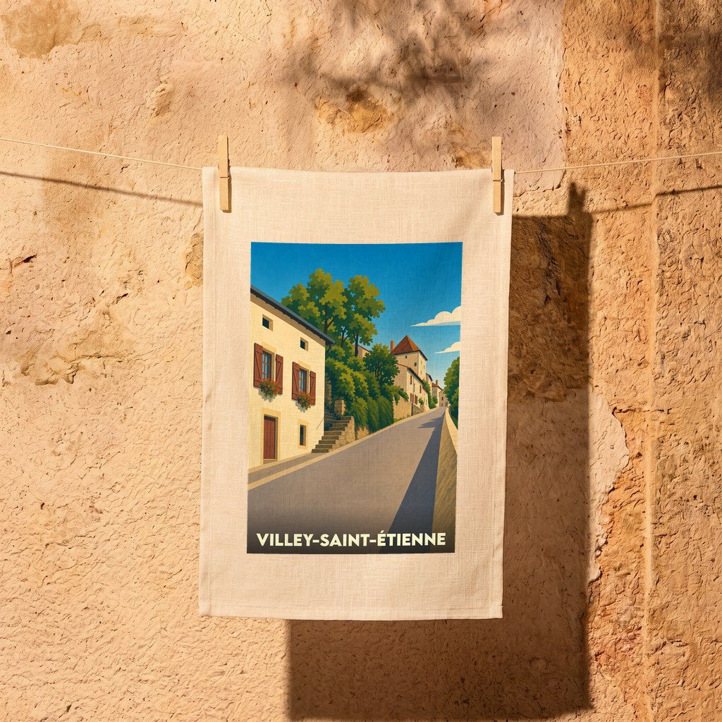 Torchon souvenir de la ville de Villey-Saint-Étienne avec une illustration stylisée d'une rue pittoresque.