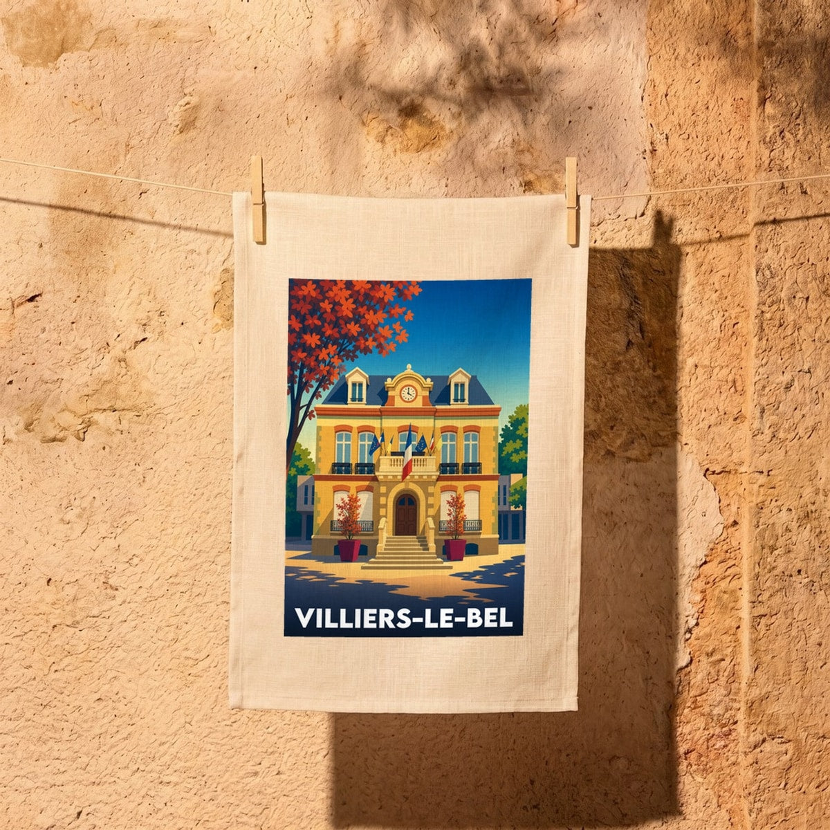 Torchon souvenir de la ville de Villiers-le-Bel avec une illustration stylisée de l'hôtel de ville.