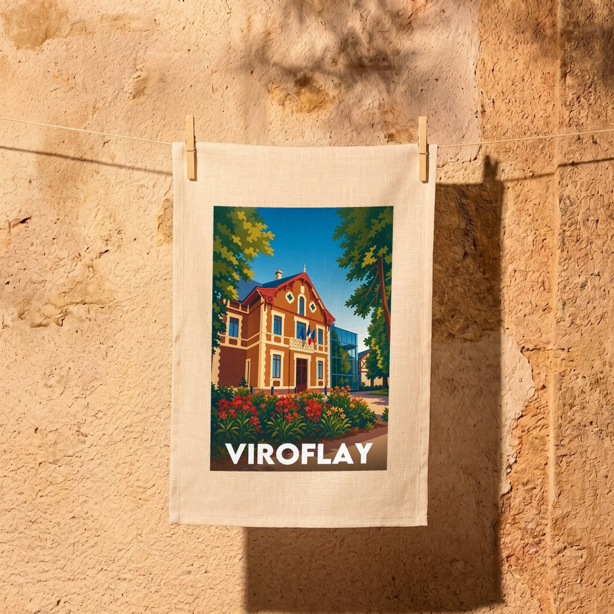 Torchon souvenir de la ville de Viroflay avec une illustration stylisée d'un bâtiment historique et de la végétation.