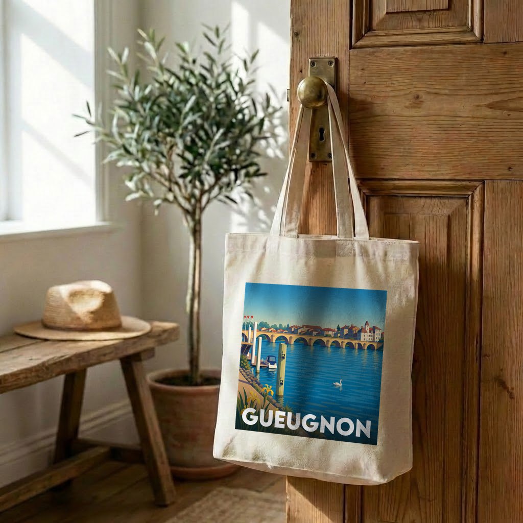 Tote bag souvenir de la ville de Gueugnon avec une illustration stylisée d'un pont sur une rivière.