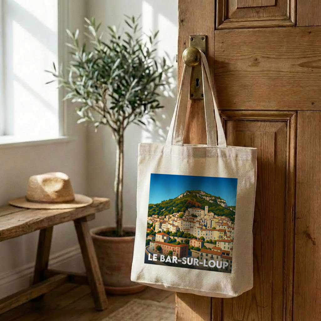 Tote bag souvenir de la ville de Le Bar-sur-Loup avec une illustration stylisée du village.