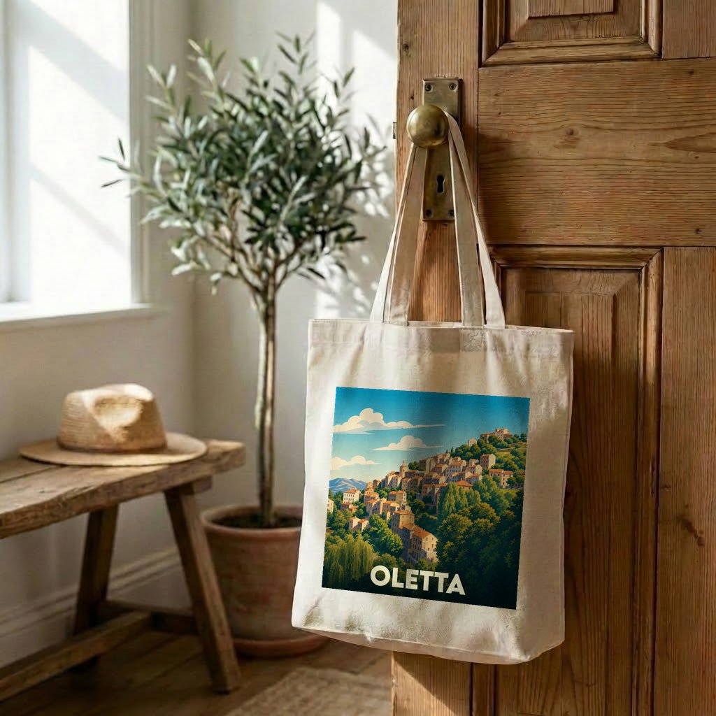 Sac cabas souvenir de la ville d'Oletta avec une illustration stylisée d'un village corse.