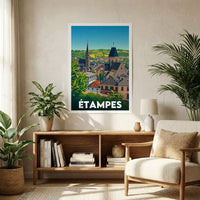 Affiche souvenir de la ville d'Étampes présentant une illustration stylisée de son paysage urbain et de ses églises historiques.