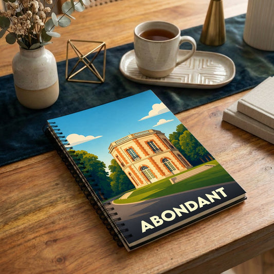 Carnet de notes souvenir de la ville d'Abondant avec une illustration stylisée d'un château.