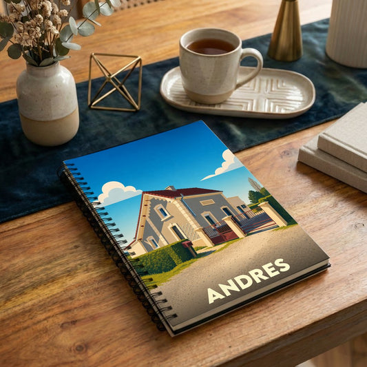 Carnet de notes souvenir de la ville de Andres avec une illustration stylisée d'une maison.