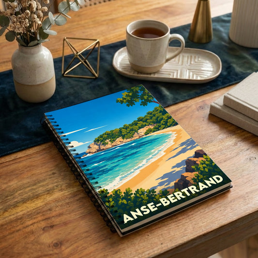 Carnet à spirales souvenir de la ville de Anse-Bertrand illustré par un paysage de plage stylisé.