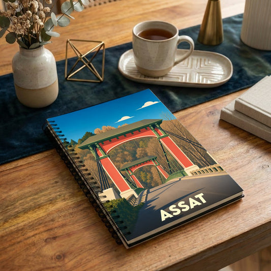 Carnet souvenir de la ville d'Assat avec une illustration stylisée de son pont suspendu.