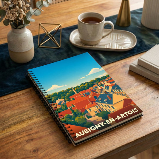 Carnet à spirales souvenir de la ville d'Aubigny-en-Artois avec une illustration stylisée.