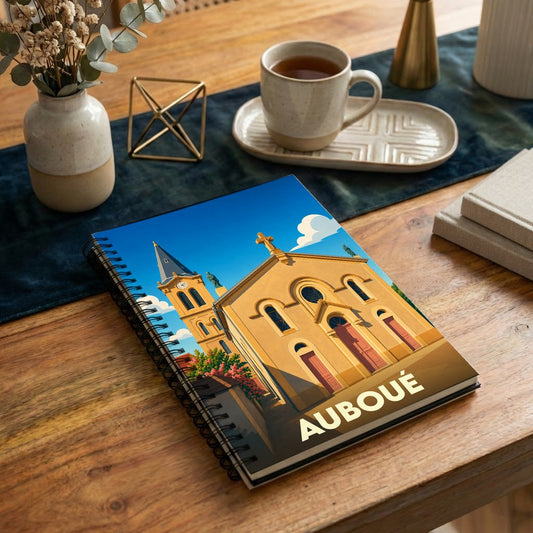Carnet souvenir de la ville de Auboué avec une illustration stylisée de son église.