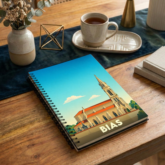 Carnet souvenir de la ville de Bias avec une illustration stylisée de son église sous un ciel bleu.