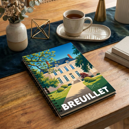 Carnet de notes à spirales souvenir de la ville de Breuillet avec une illustration stylisée d'une demeure bourgeoise.