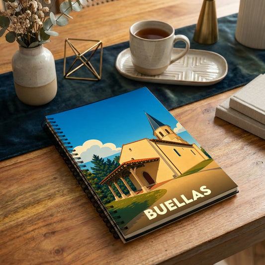 Carnet souvenir de la ville de Buellas avec une illustration stylisée de son église sous un ciel bleu.