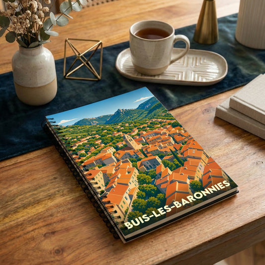 Carnet de notes souvenir de la ville de Buis-les-Baronnies avec une illustration panoramique stylisée.