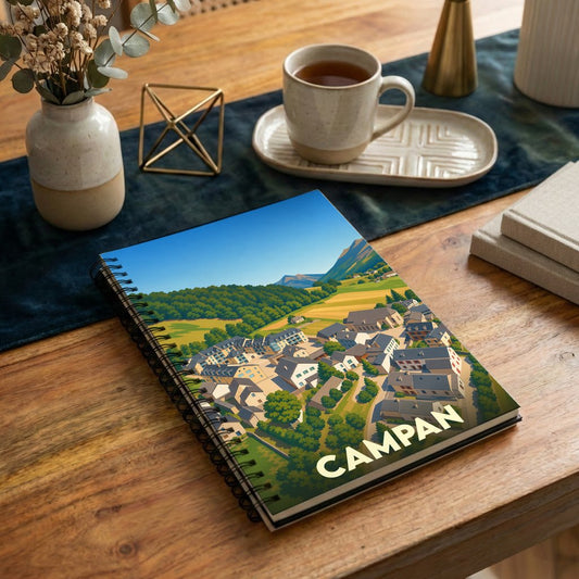 Carnet de notes souvenir de la ville de Campan avec une illustration stylisée.