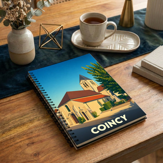 Carnet à spirales souvenir de la ville de Coincy avec une illustration stylisée de son église.