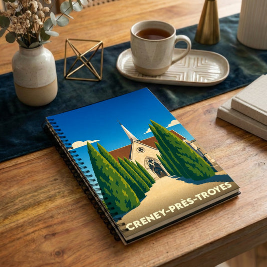 Carnet souvenir de la ville de Creney-près-Troyes avec une illustration stylisée de son église.