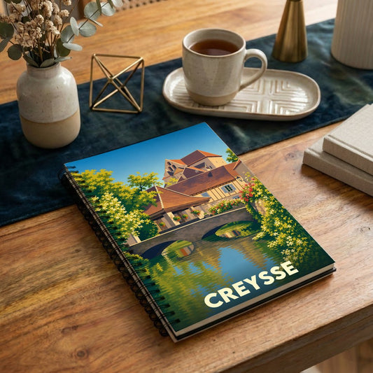 Carnet souvenir de la ville de Creysse avec une illustration stylisée.