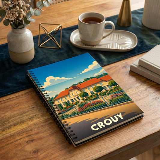 Carnet à spirales souvenir de la ville de Crouy avec une illustration stylisée.