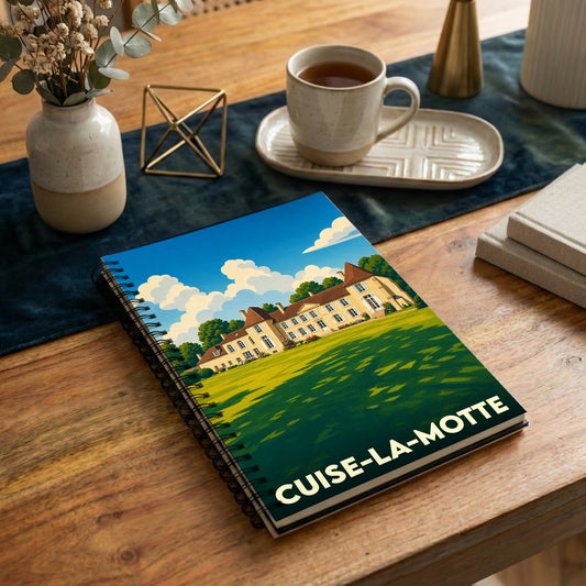 Carnet à spirales souvenir de la ville de Cuise-la-Motte avec une illustration stylisée de château.