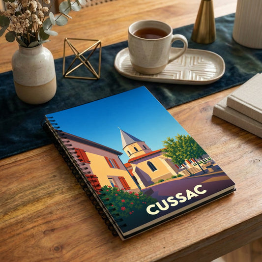 Carnet à spirales souvenir de la ville de Cussac avec une illustration stylisée.