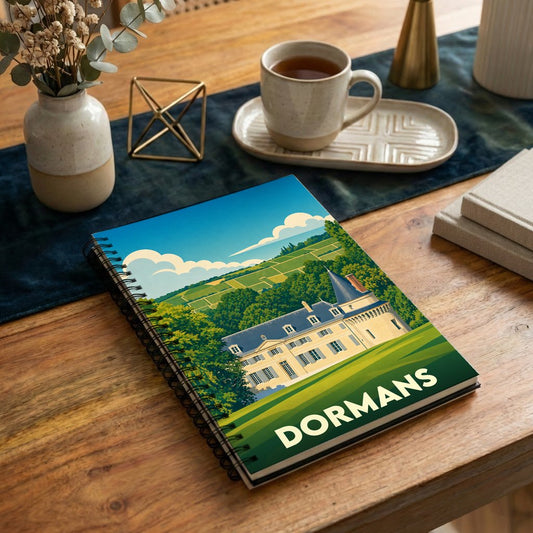 Carnet de notes souvenir de la ville de Dormans avec une illustration stylisée d'un château entouré de vignobles.