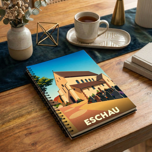 Carnet souvenir de la ville d'Eschau avec une illustration stylisée de son église romane.