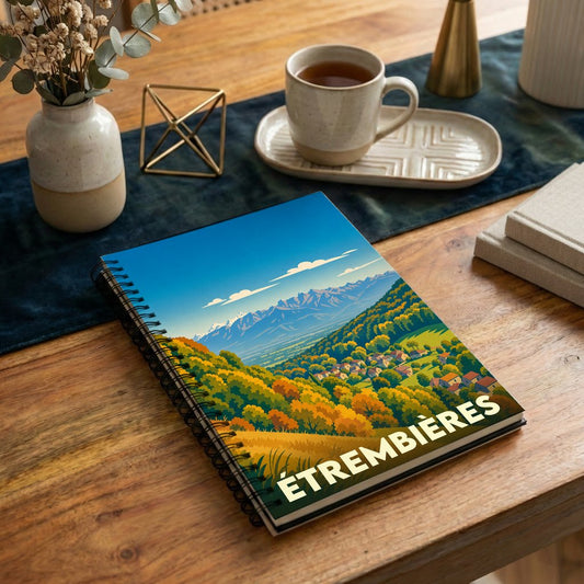 Carnet souvenir de la ville de Étrembières avec une illustration stylisée de paysages montagneux.