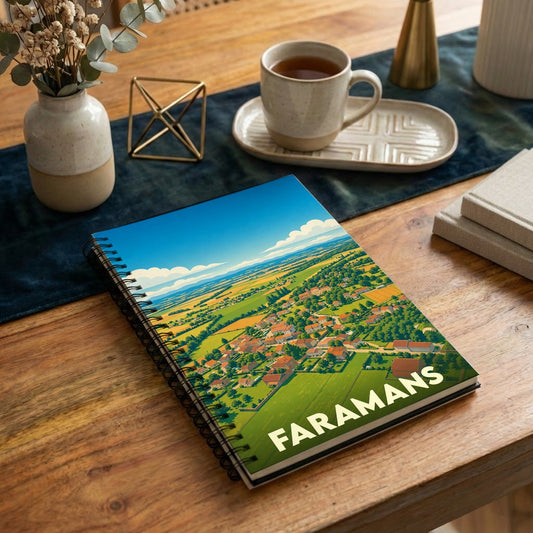Carnet de notes à spirales souvenir de la ville de Faramans avec une illustration paysagère stylisée.