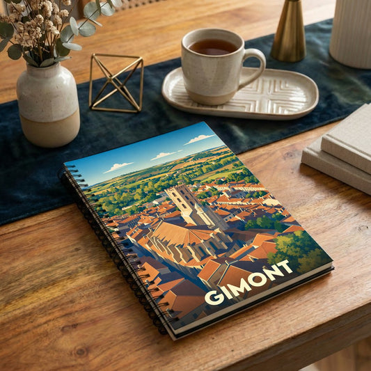 Carnet à spirales souvenir de la ville de Gimont avec une illustration stylisée vue du ciel.