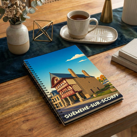 Carnet à spirales souvenir de la ville de Guémené-sur-Scorff illustré d'un bâtiment historique stylisé.