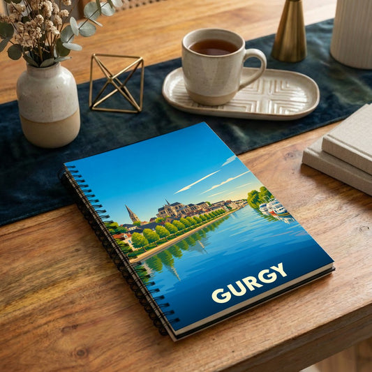 Carnet de notes souvenir de la ville de Gurgy avec une illustration stylisée d'un paysage de bord d'eau.