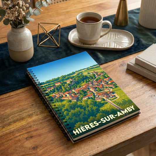 Carnet à spirales souvenir de la ville de Hières-sur-Amby avec une illustration stylisée.