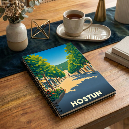 Carnet de notes à spirales souvenir de la ville de Hostun avec une illustration stylisée.