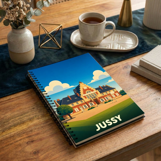 Carnet souvenir de la ville de Jussy avec une illustration stylisée.