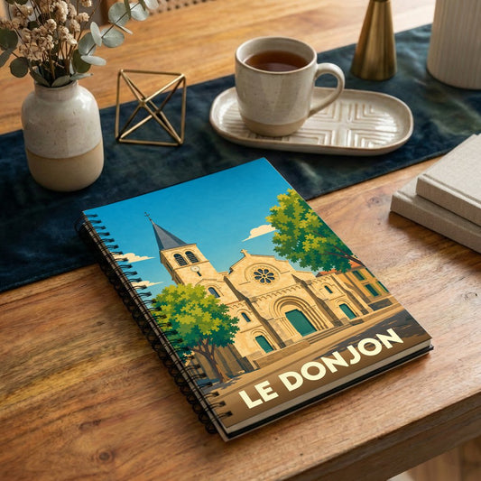 Carnet de notes souvenir de la ville de Le Donjon avec une illustration stylisée de son église.