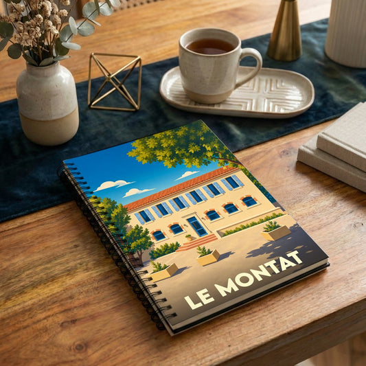 Carnet à spirales souvenir de la ville de Le Montat avec une illustration stylisée.