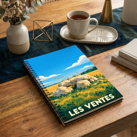 Carnet souvenir de la ville de Les Ventes avec une illustration stylisée de dolmens dans un paysage champêtre.
