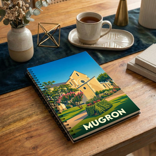 Carnet à spirales souvenir de la ville de Mugron avec une illustration stylisée de son église.