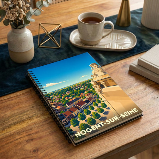 Carnet souvenir à spirale de la ville de Nogent-sur-Seine avec une illustration stylisée vue du ciel.