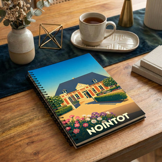 Carnet à spirales souvenir de la ville de Nointot avec une illustration stylisée.