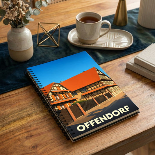 Carnet à spirales souvenir de la ville d'Offendorf orné d'une illustration stylisée de maisons à colombages.