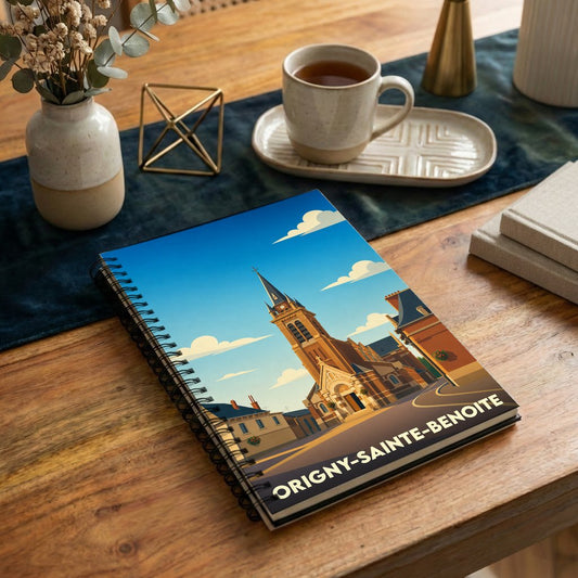 Carnet à spirales souvenir de la ville d'Origny-Sainte-Benoite avec une illustration stylisée de son église.