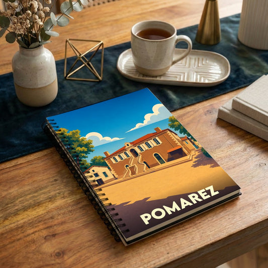 Carnet à spirale souvenir de la ville de Pomarez avec une illustration stylisée.