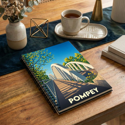 Carnet souvenir de la ville de Pompey avec une illustration stylisée d'un pont.