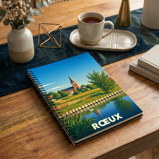 Carnet souvenir de la ville de Rœux avec une illustration stylisée de son église au bord de l'eau.