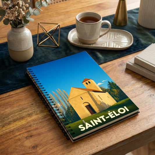 Carnet de notes souvenir de la ville de Saint-Éloi avec une illustration stylisée de son église.