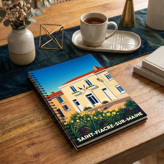 Carnet souvenir de la ville de Saint-Fiacre-sur-Maine avec une illustration stylisée d'un bâtiment fleuri sous un ciel bleu.