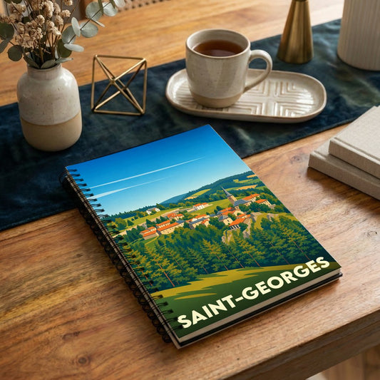 Carnet souvenir de la ville de Saint-Georges avec une illustration stylisée d'un village vallonné.
