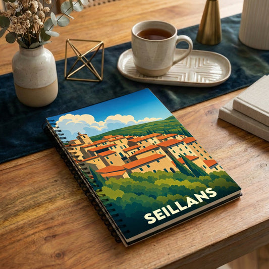 Carnet souvenir de la ville de Seillans avec une illustration stylisée d'un village provençal.
